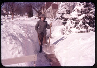 Kent Liska with snow shovel, 1950s