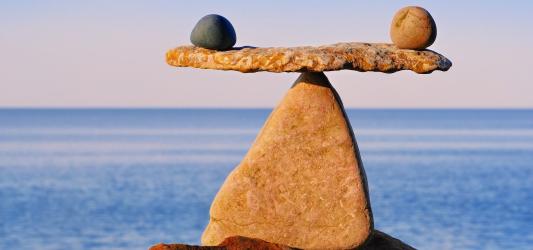 stones balancing on top of another rock