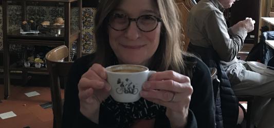 Terry Cohn sitting in a coffee shop in Barcelona, prior to coming home to Madison