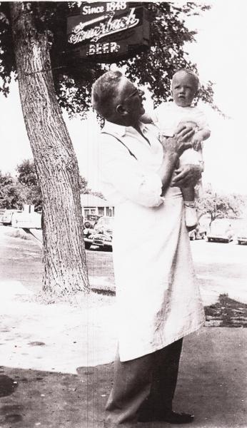 Bill Herling with Dennis Herling, in front of Herling's Tavern, 1943