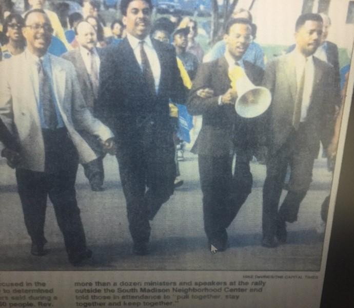 Photo of newspaper clipping featuring David Smith at protest, 1992
