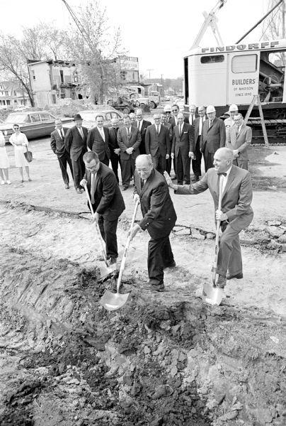 Sam Schwartz (center with shovel) participates in groundbreaking ceremony for a new medical center building at 20 S. Park Street, Madison 1965.