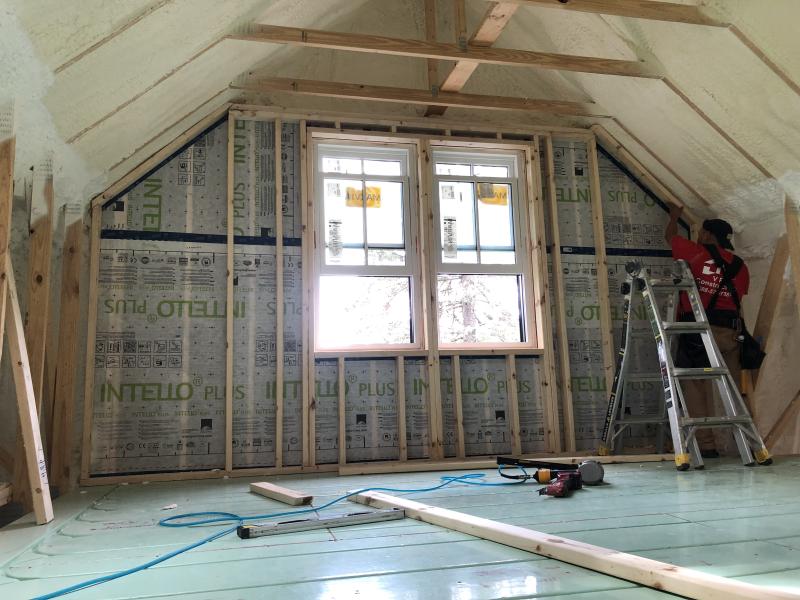 VR Construction, work on the inside of an attic, Madison, ca 2020