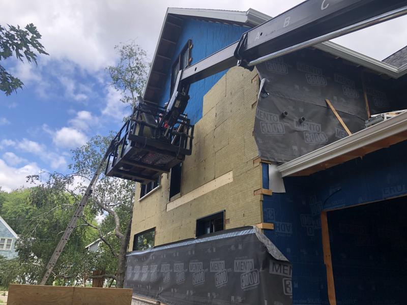 VR Construction, work on house exterior with a cherry picker, Madison, ca 2020